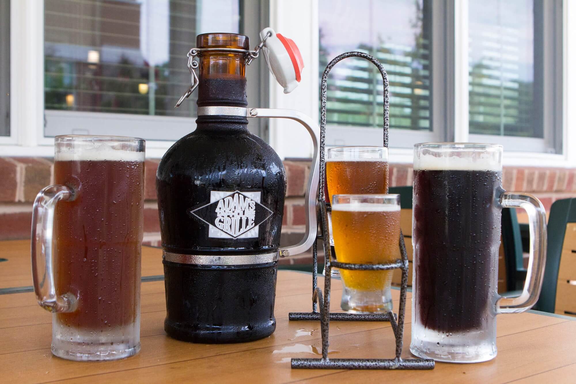 Adams Grille & Taphouse growler of beer, pints and a flight of beer